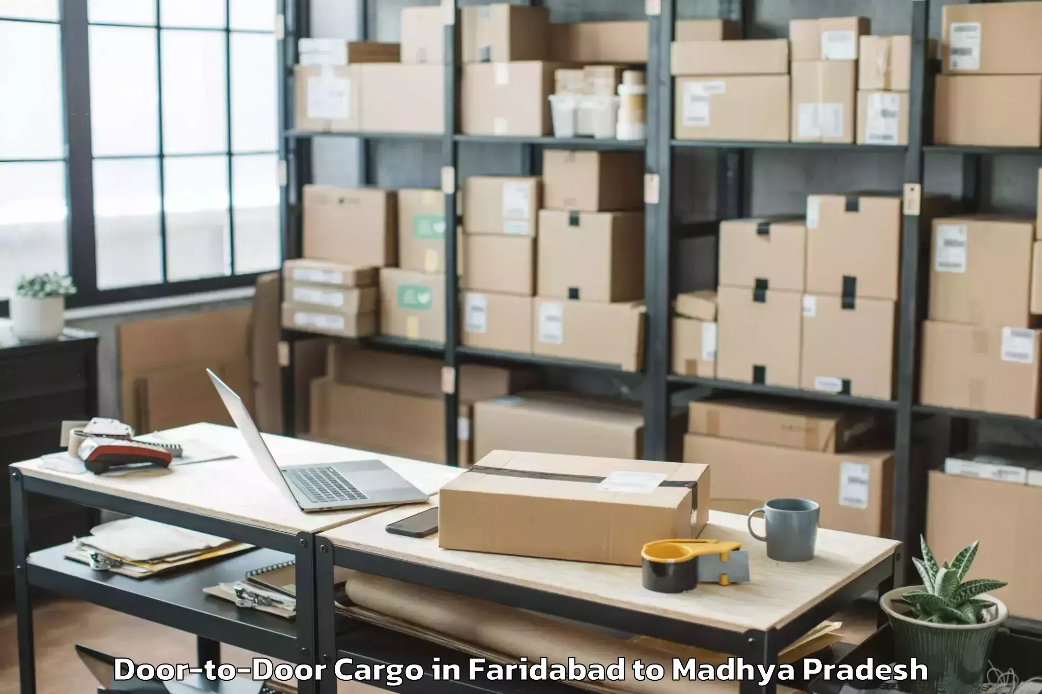 Leading Faridabad to Sendhwa Door To Door Cargo Provider